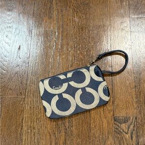 Navy and white Coach wristlet